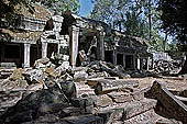 Ta Prohm temple - the badly ruined gopura of the gallery first found entering the site from west